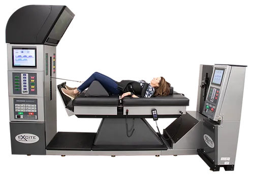 A person positioned on a spinal decompression table